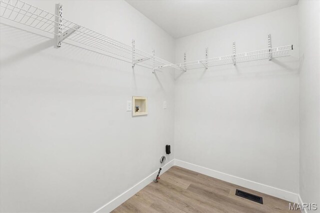 4507 Behlmann Grove Pl, Florissant, MO 63034 - laundry area with light wood finished floors and hookup for a washing machine