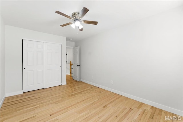 4507 Behlmann Grove Pl, Florissant, MO 63034 - unfurnished bedroom featuring light wood finished floors, a closet, and a ceiling fan