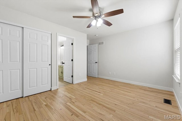 4507 Behlmann Grove Pl, Florissant, MO 63034 - unfurnished bedroom with light wood-type flooring, connected bathroom, a closet, and a ceiling fan