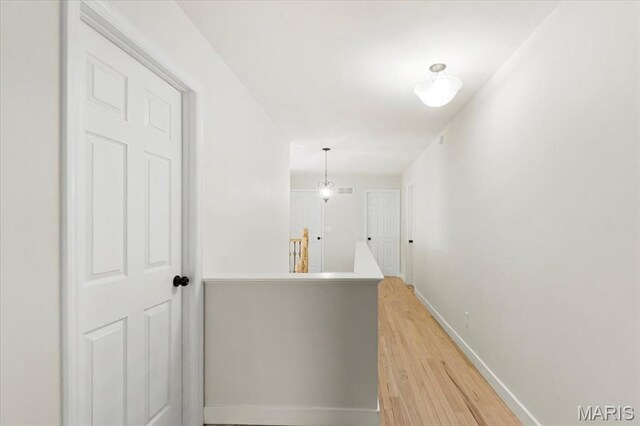 4507 Behlmann Grove Pl, Florissant, MO 63034 - hall with light wood finished floors and an upstairs landing