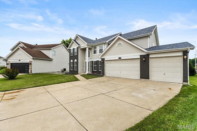 4507 Behlmann Grove Pl, Florissant, MO 63034 - traditional-style house with a front lawn, concrete driveway, an attached garage, and roof with shingles