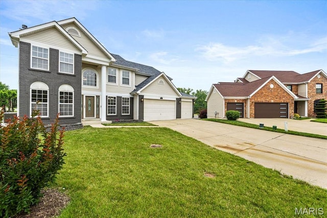 4507 Behlmann Grove Pl, Florissant, MO 63034 - view of front of property featuring concrete driveway, an attached garage, a front lawn, and brick siding