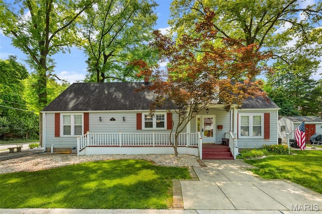 900 Danforth St, Alton, IL 62002 - cape cod-style house featuring a porch, a front lawn, and a shingled roof