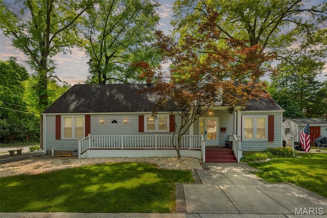 900 Danforth St, Alton, IL 62002 - new england style home featuring covered porch, a lawn, and roof with shingles
