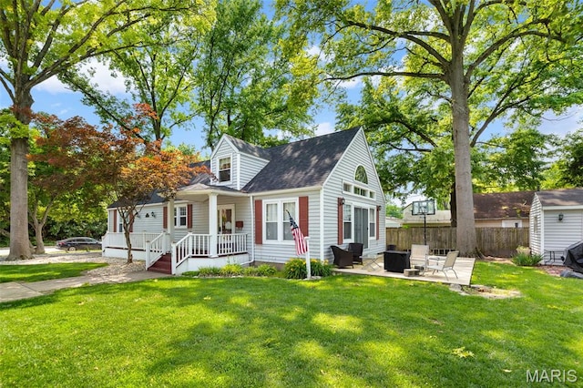 900 Danforth St, Alton, IL 62002 - cape cod house with a porch, a shingled roof, and a patio area