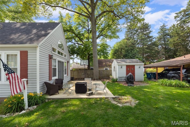 900 Danforth St, Alton, IL 62002 - view of yard with a storage shed and a patio area