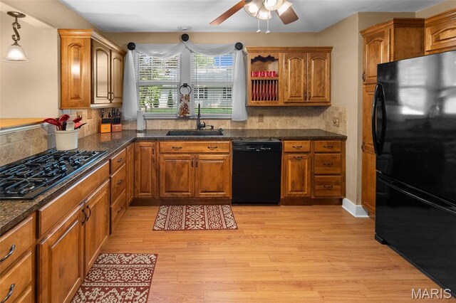 900 Danforth St, Alton, IL 62002 - kitchen featuring black appliances, a ceiling fan, brown cabinetry, and light wood-style floors
