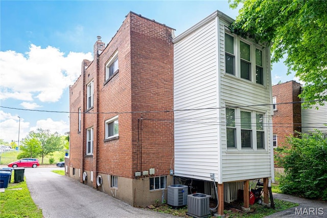 1323 Woodland Dr, Saint Louis, MO 63117 - view of home's exterior with a central air condition unit