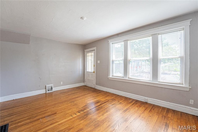 1323 Woodland Dr, Saint Louis, MO 63117 - empty room with light wood-type flooring and baseboards
