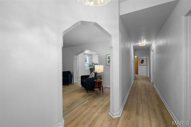 4950 Eichelberger St, Saint Louis, MO 63109 - hallway with arched walkways and light wood-type flooring