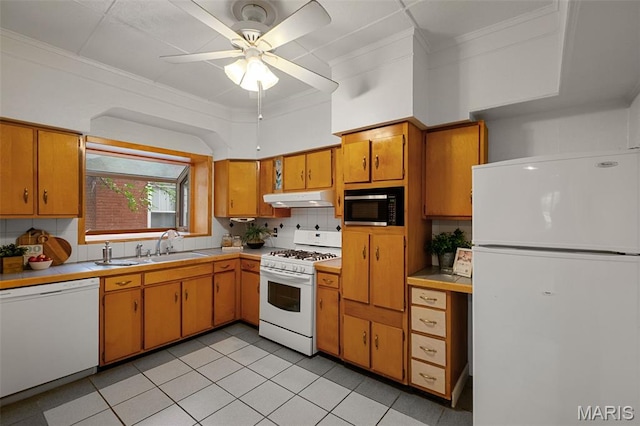4950 Eichelberger St, Saint Louis, MO 63109 - kitchen featuring white appliances, under cabinet range hood, ceiling fan, light countertops, and ornamental molding