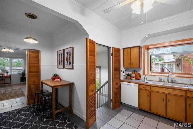 4950 Eichelberger St, Saint Louis, MO 63109 - kitchen with dishwasher, ceiling fan, light tile patterned floors, crown molding, and hanging light fixtures