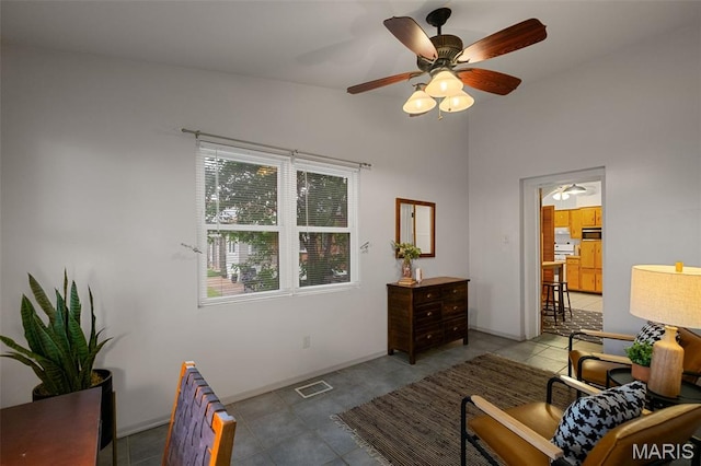 4950 Eichelberger St, Saint Louis, MO 63109 - tiled living area featuring a ceiling fan and baseboards