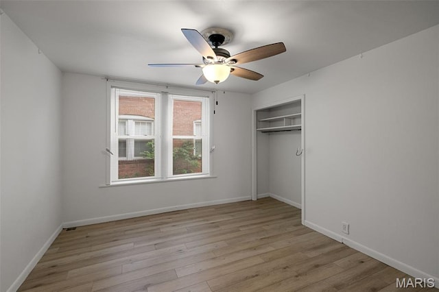 4950 Eichelberger St, Saint Louis, MO 63109 - unfurnished bedroom with light wood-type flooring, a closet, and ceiling fan