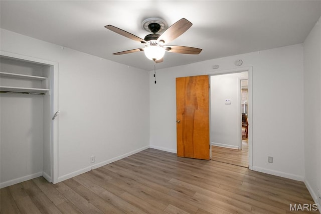 4950 Eichelberger St, Saint Louis, MO 63109 - unfurnished bedroom with wood finished floors, a ceiling fan, and a closet