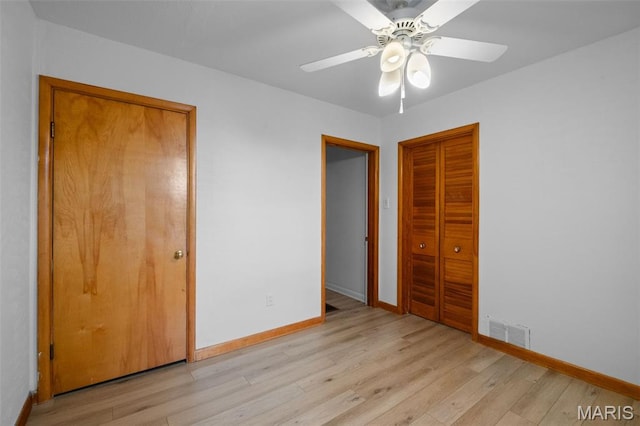 4950 Eichelberger St, Saint Louis, MO 63109 - unfurnished bedroom featuring light wood-style floors, a closet, and ceiling fan