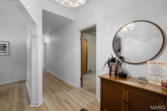 4950 Eichelberger St, Saint Louis, MO 63109 - hallway with light wood-type flooring and arched walkways
