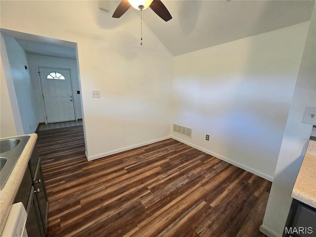 411 Williams St, Bethalto, IL 62010 - unfurnished room featuring dark wood finished floors, vaulted ceiling, and ceiling fan