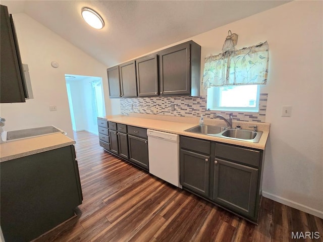 411 Williams St, Bethalto, IL 62010 - kitchen featuring dishwasher, vaulted ceiling, tasteful backsplash, dark wood finished floors, and light countertops