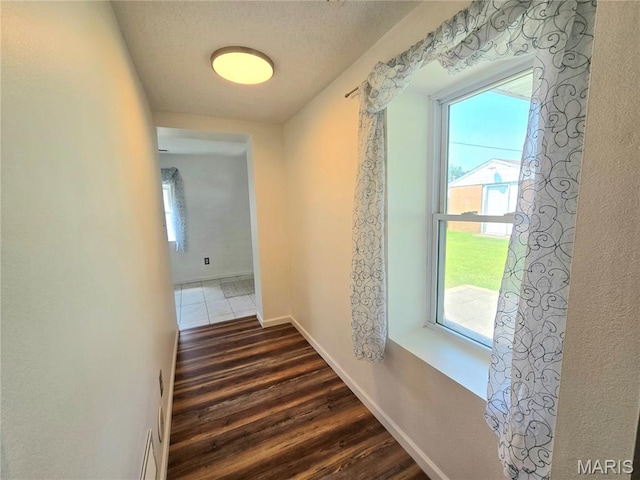 411 Williams St, Bethalto, IL 62010 - corridor with wood finished floors and a textured ceiling