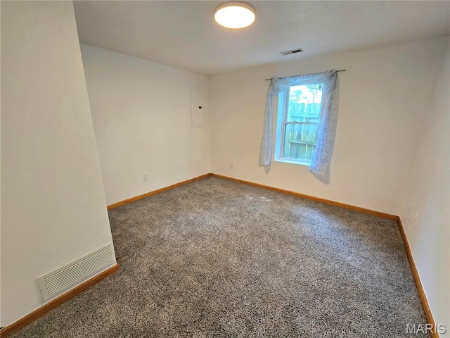 411 Williams St, Bethalto, IL 62010 - carpeted empty room featuring baseboards and electric panel