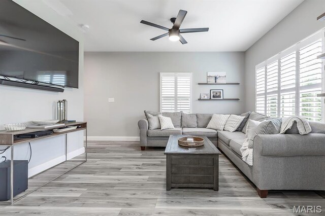 2625 Grover Crossing Way, Wildwood, MO 63040 - living area featuring a ceiling fan and light wood-style flooring