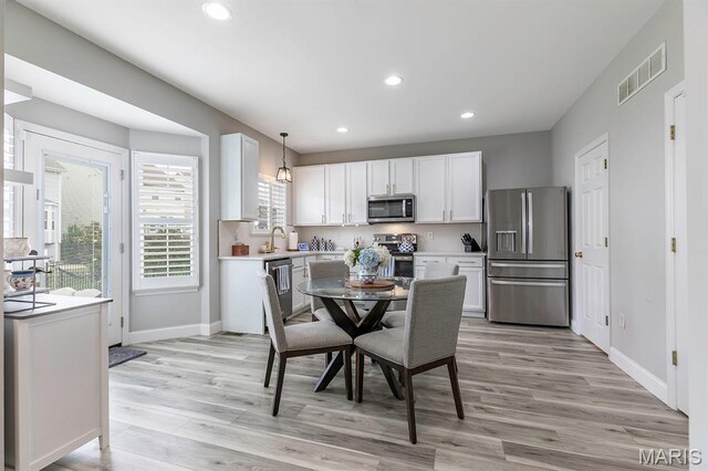 2625 Grover Crossing Way, Wildwood, MO 63040 - dining area with light wood-type flooring and recessed lighting