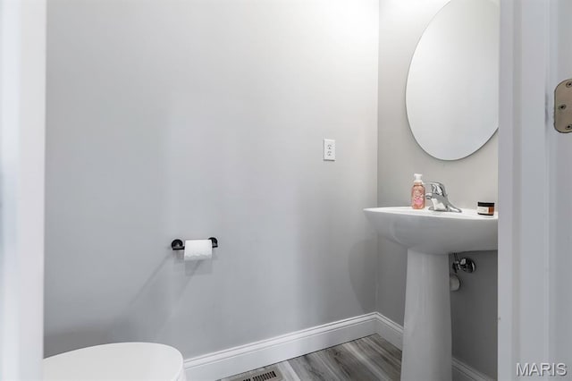 2625 Grover Crossing Way, Wildwood, MO 63040 - half bath featuring toilet and wood finished floors