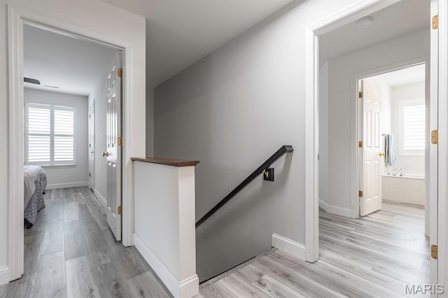 2625 Grover Crossing Way, Wildwood, MO 63040 - hall featuring an upstairs landing and light wood-type flooring