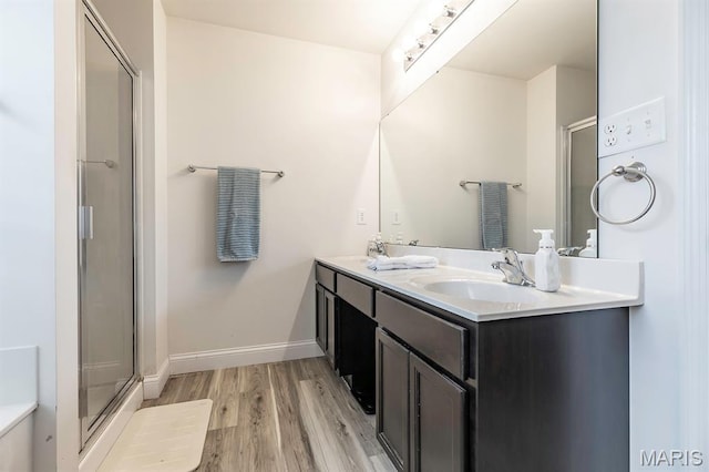 2625 Grover Crossing Way, Wildwood, MO 63040 - full bath featuring wood finished floors, double vanity, and a shower stall