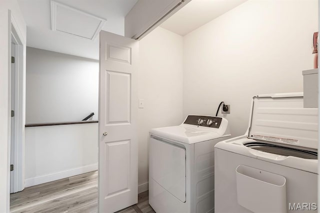 2625 Grover Crossing Way, Wildwood, MO 63040 - laundry room featuring washer and dryer, light wood-style flooring, and attic access