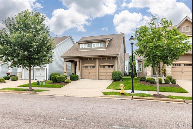 2625 Grover Crossing Way, Wildwood, MO 63040 - craftsman-style house featuring driveway, stone siding, roof with shingles, and stucco siding