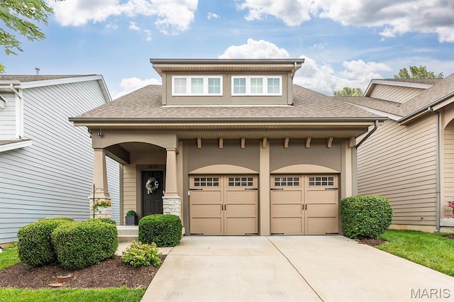 2625 Grover Crossing Way, Wildwood, MO 63040 - view of front of house with driveway, covered porch, a shingled roof, and stucco siding