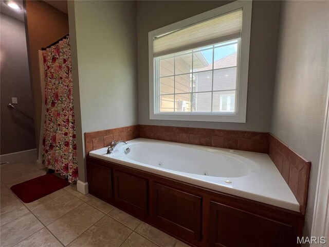 306 Traci Dawn Dr, Rolla, MO 65401 - full bathroom with tile patterned flooring, a jetted tub, and a shower with curtain