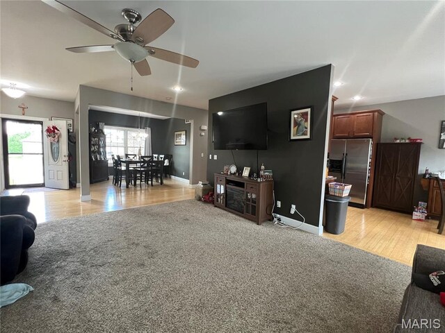 306 Traci Dawn Dr, Rolla, MO 65401 - living area featuring a ceiling fan and light wood-style floors