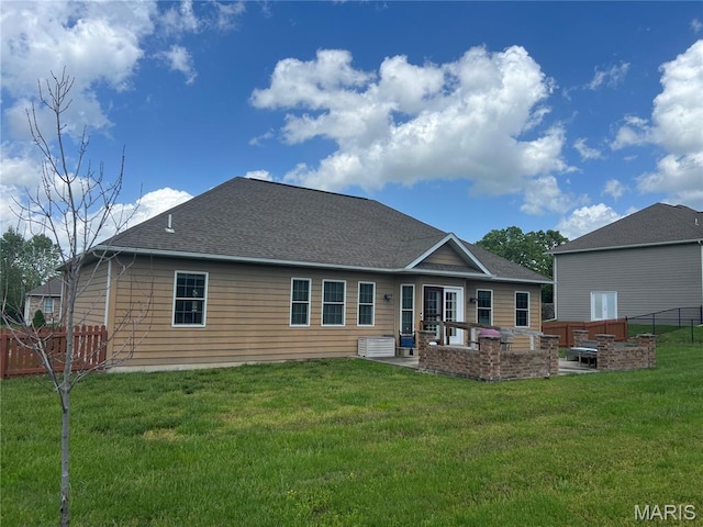306 Traci Dawn Dr, Rolla, MO 65401 - back of property with a patio area, a fenced backyard, a shingled roof, and outdoor lounge area