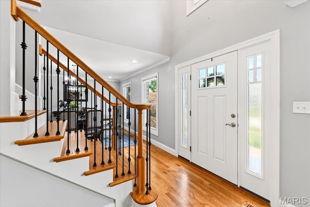 16544 Willow Glen Dr, Wildwood, MO 63040 - entrance foyer featuring wood finished floors, stairway, crown molding, and recessed lighting