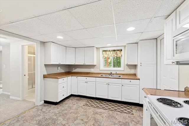 16544 Willow Glen Dr, Wildwood, MO 63040 - kitchen featuring a drop ceiling, white cabinets, white appliances, and recessed lighting