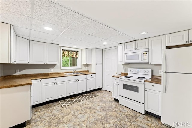 16544 Willow Glen Dr, Wildwood, MO 63040 - kitchen featuring white appliances, white cabinetry, recessed lighting, dark countertops, and a drop ceiling