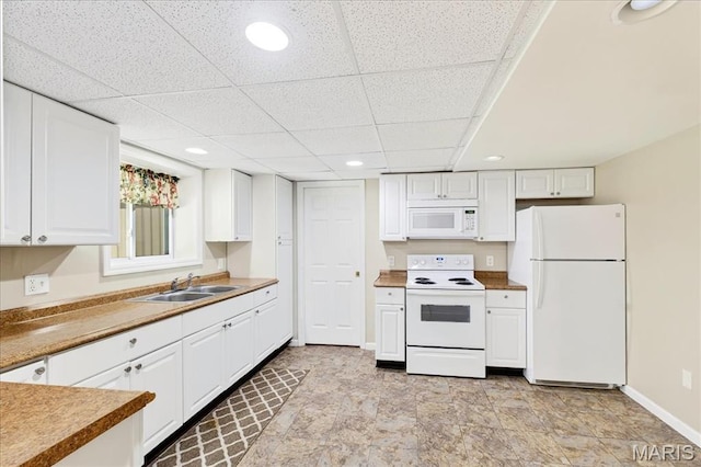 16544 Willow Glen Dr, Wildwood, MO 63040 - kitchen featuring white appliances, white cabinetry, a drop ceiling, and recessed lighting