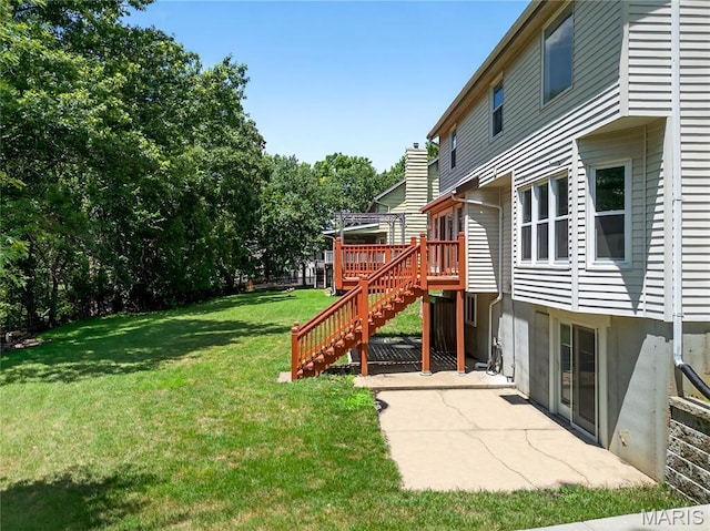 16544 Willow Glen Dr, Wildwood, MO 63040 - view of grassy yard with stairway, a wooden deck, and a patio area