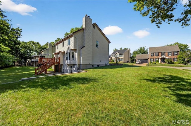 16544 Willow Glen Dr, Wildwood, MO 63040 - rear view of house with stairway, a yard, a chimney, and a deck