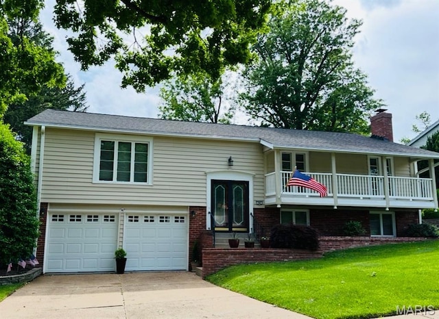 747 Agean Way, Ballwin, MO 63011 - split foyer home with driveway, an attached garage, a front yard, a chimney, and a balcony