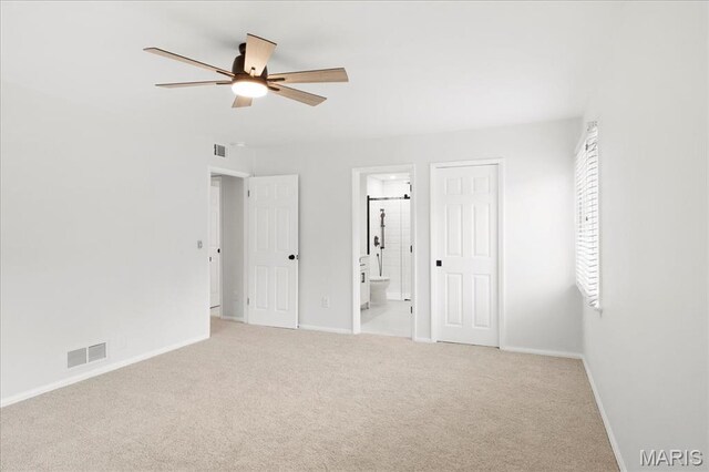 15371 Timber Hill Ln, Chesterfield, MO 63017 - unfurnished bedroom featuring carpet, connected bathroom, and a ceiling fan