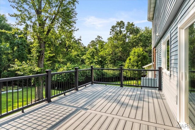 15371 Timber Hill Ln, Chesterfield, MO 63017 - wooden deck featuring a lawn