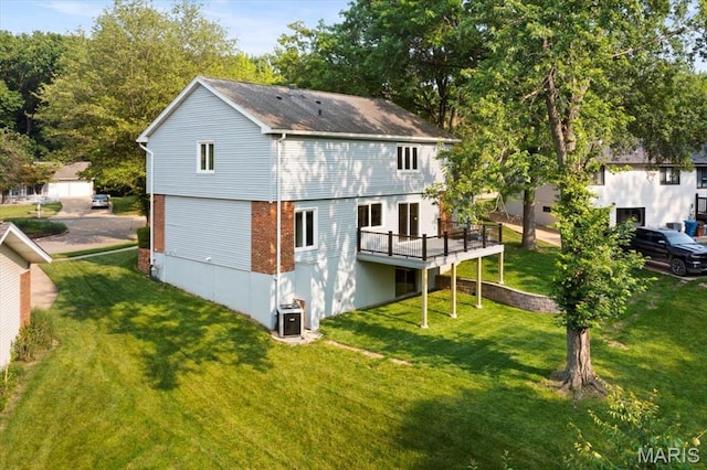 15371 Timber Hill Ln, Chesterfield, MO 63017 - back of property with a yard, a wooden deck, and brick siding