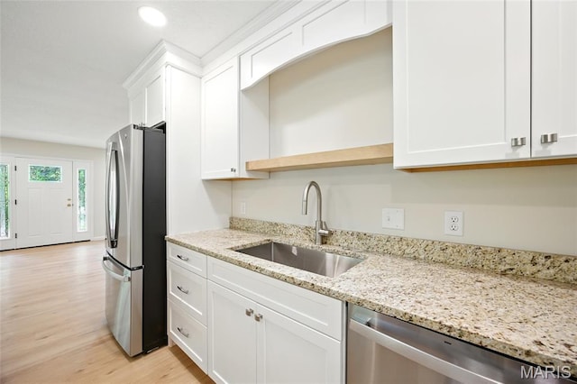 6905 Scenic View Dr, Cedar Hill, MO 63016 - kitchen with stainless steel appliances, light wood-type flooring, white cabinets, light stone countertops, and recessed lighting