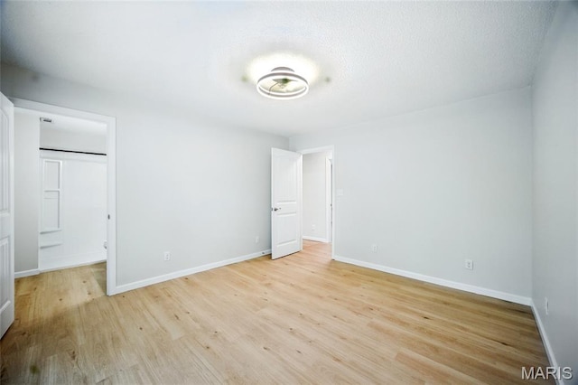6905 Scenic View Dr, Cedar Hill, MO 63016 - unfurnished bedroom with light wood-type flooring and a spacious closet
