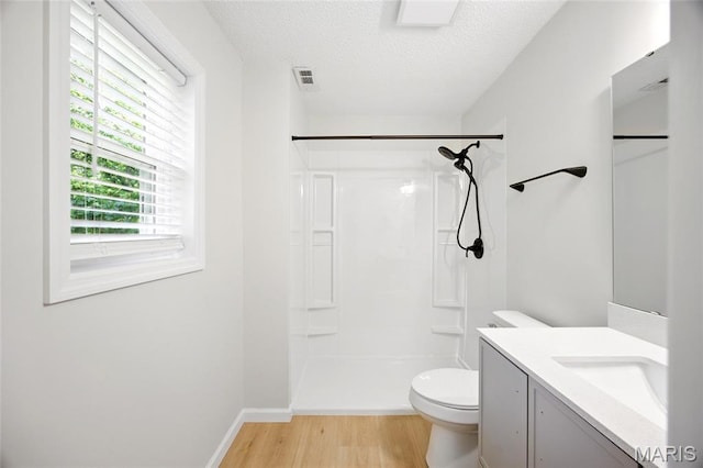 6905 Scenic View Dr, Cedar Hill, MO 63016 - full bath with a shower, wood finished floors, vanity, and a textured ceiling