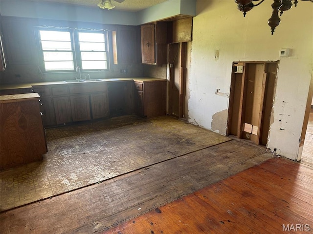 340 S Kitchen St, Dexter, MO 63841 - kitchen featuring wood-type flooring and light countertops